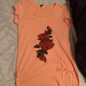 Peach dress with roses .